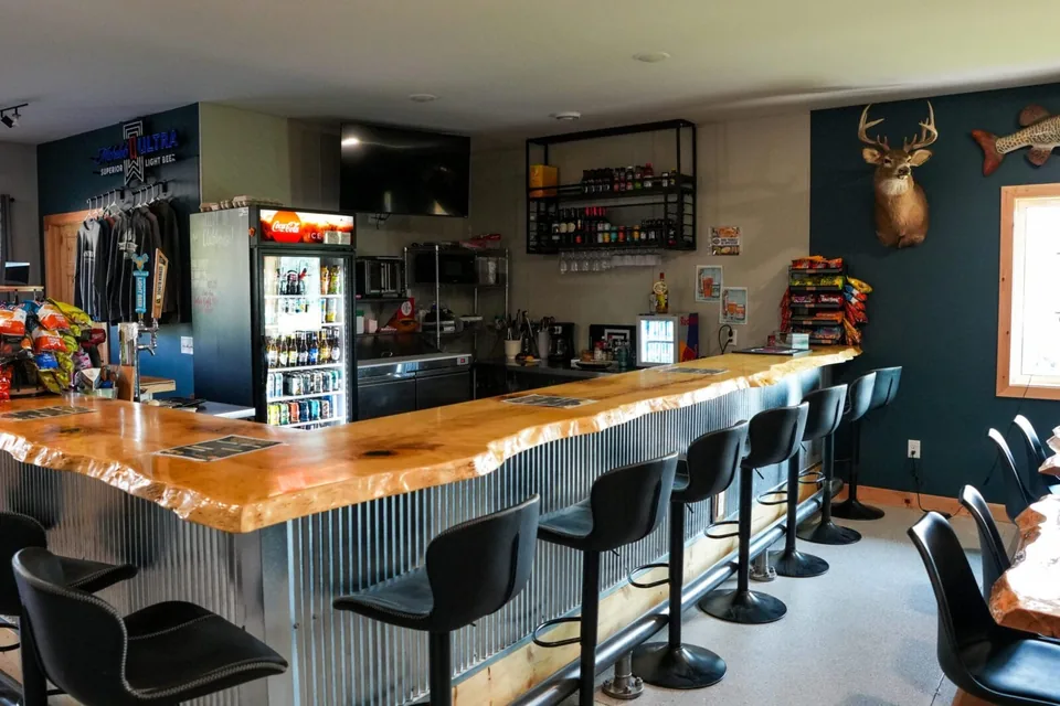 Wooden bar and seating inside the Grant Haven clubhouse