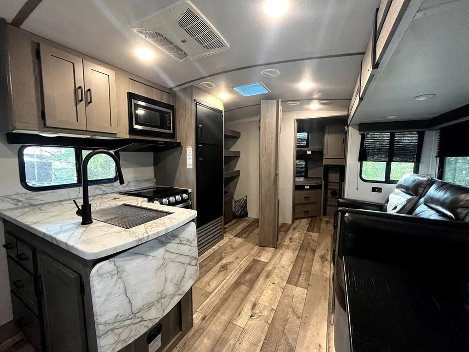 Kitchen and living area inside the Grant Haven Suite rental camper