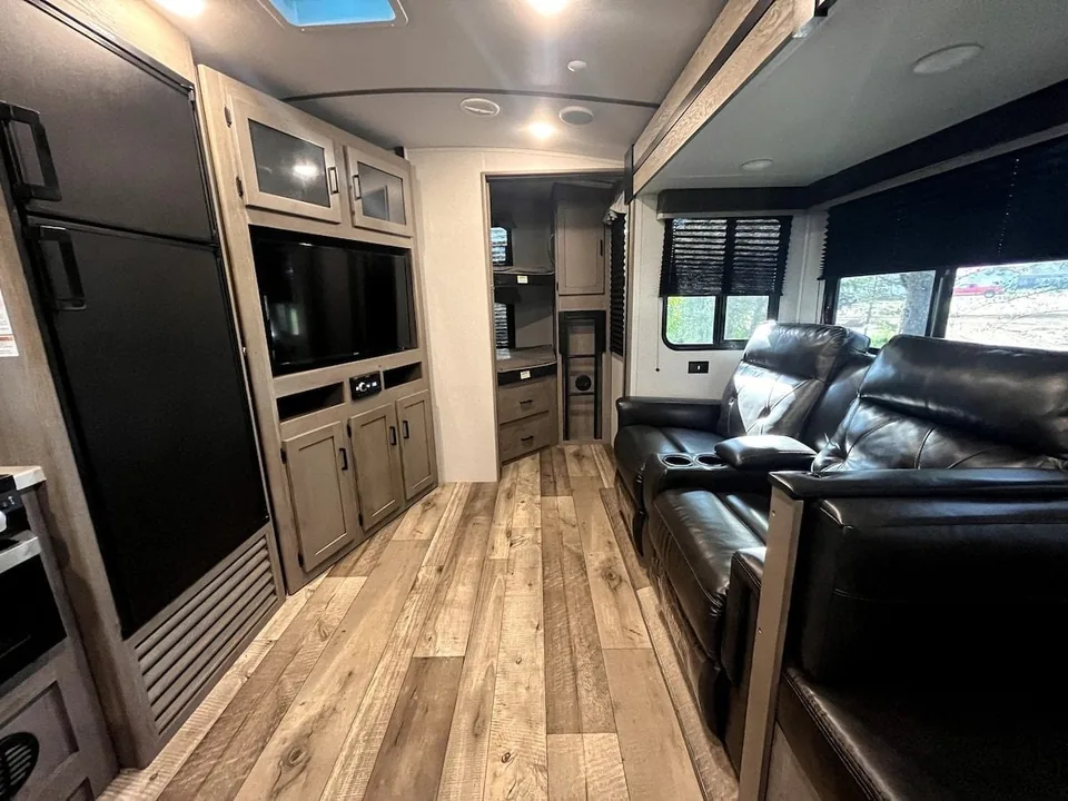 Reclining seats and kitchen inside the Grant Haven Suite