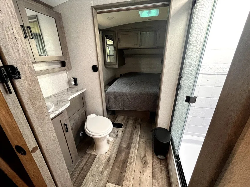 Bathroom with vanity, toilet, and shower in the Grant Haven Suite