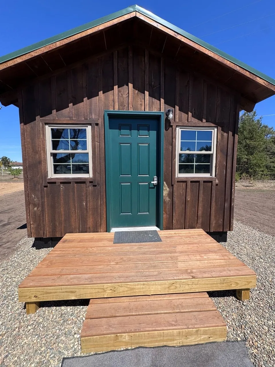 Green Door Cabin front entrance and wooden steps