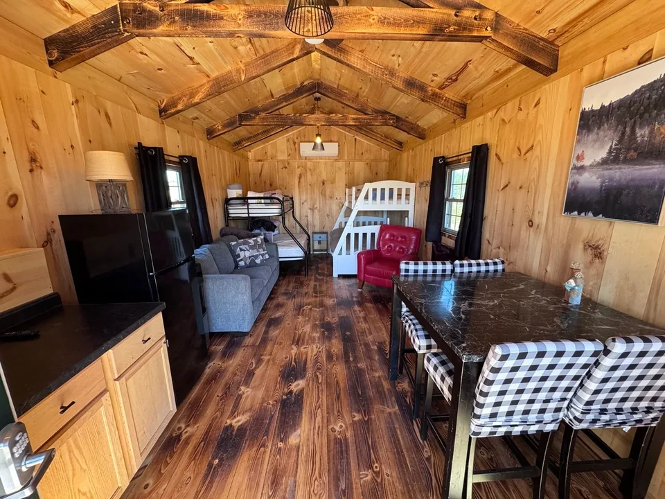 Kitchen, bunks, and sitting area inside the Green Door Cabin