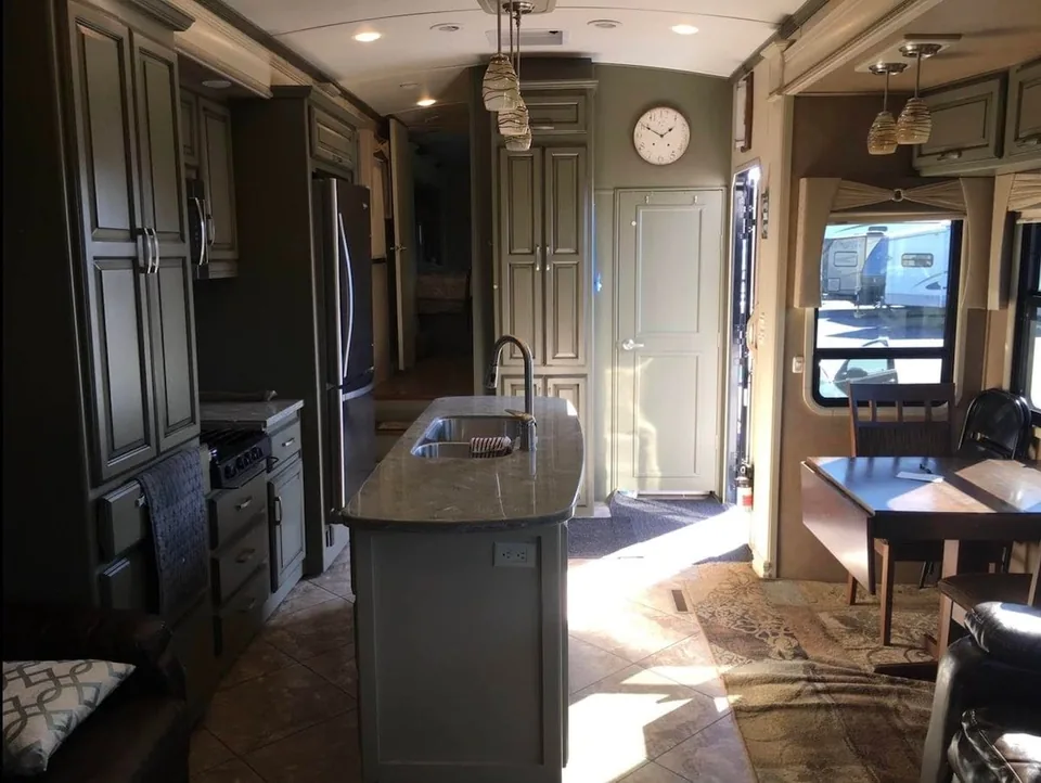 Kitchen island and living space inside the Grant Haven Premier Suite