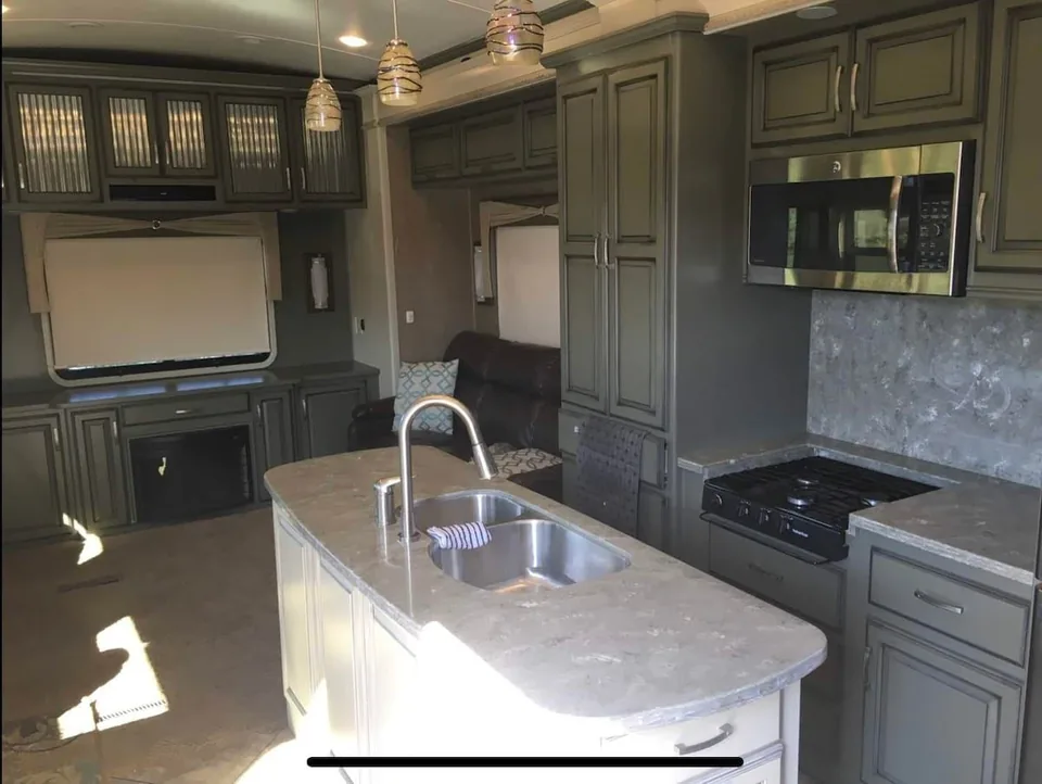 Kitchen island, sink, and appliances in the Grant Haven Premier Suite