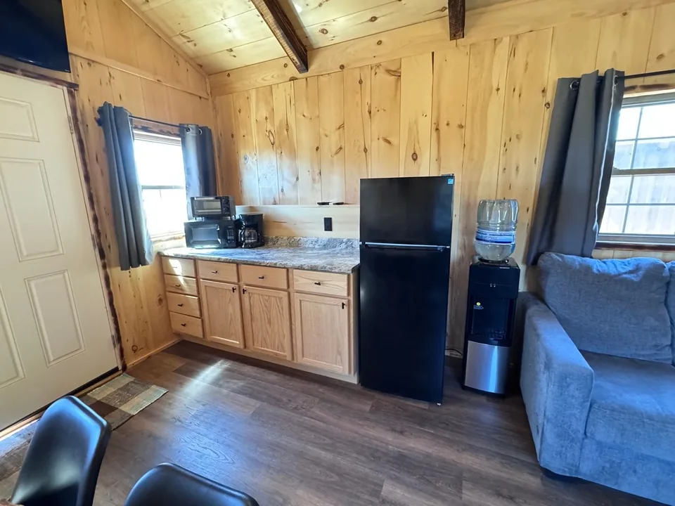 Kitchenette and refrigerator in the Red Door Cabin