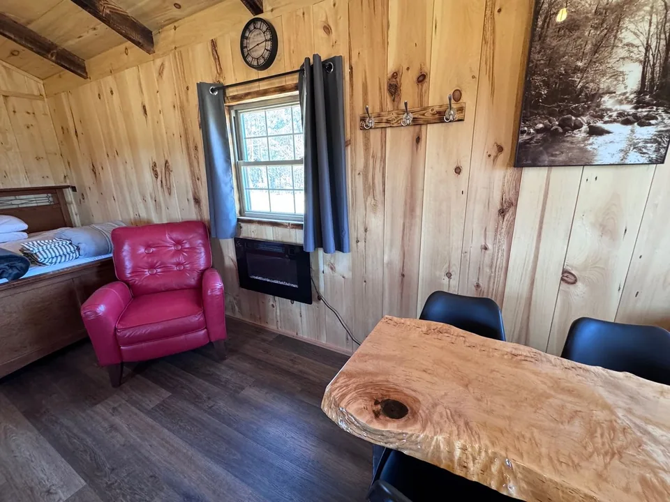 Armchair and dining table inside the Red Door Cabin