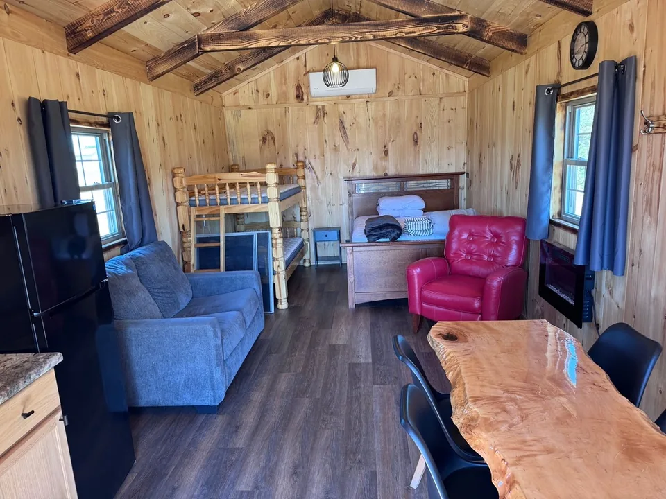Kitchen, seating, and bunks inside the Red Door Cabin