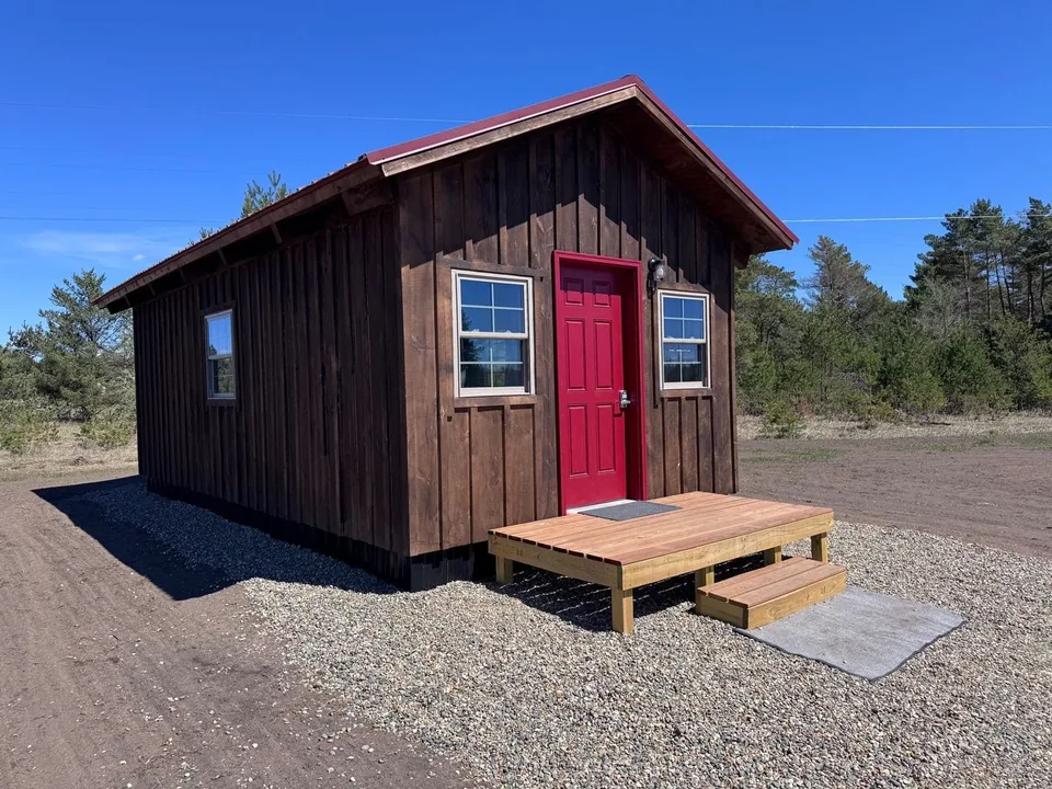 Red Door Cabin exterior with a bright red entrance door